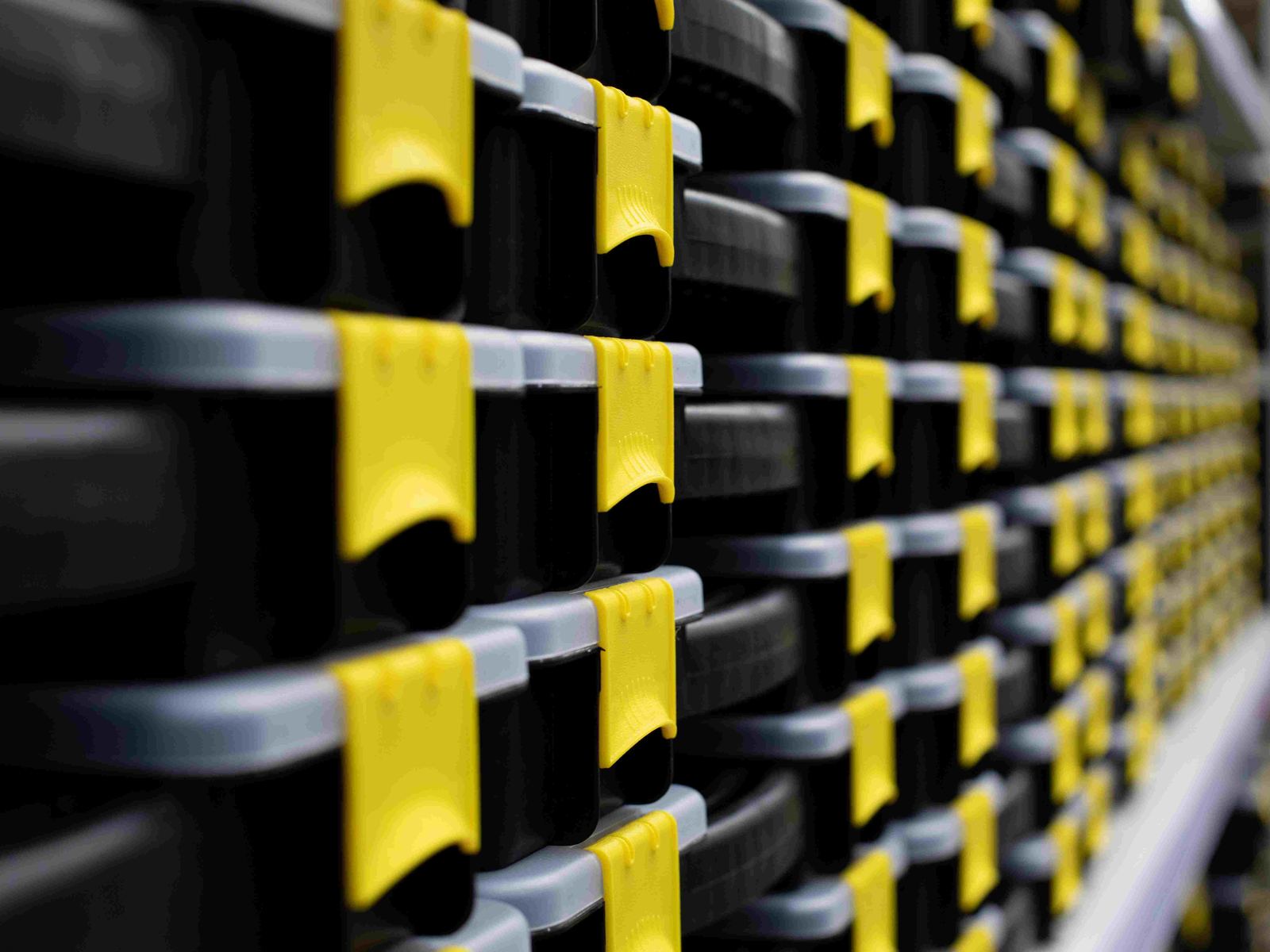 Rows of stacked storage bins ready for secure storage